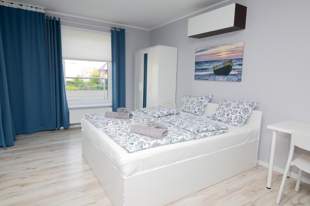 Posteľ alebo postele v izbe v ubytovaní Apartamenty 4YOU Hel
