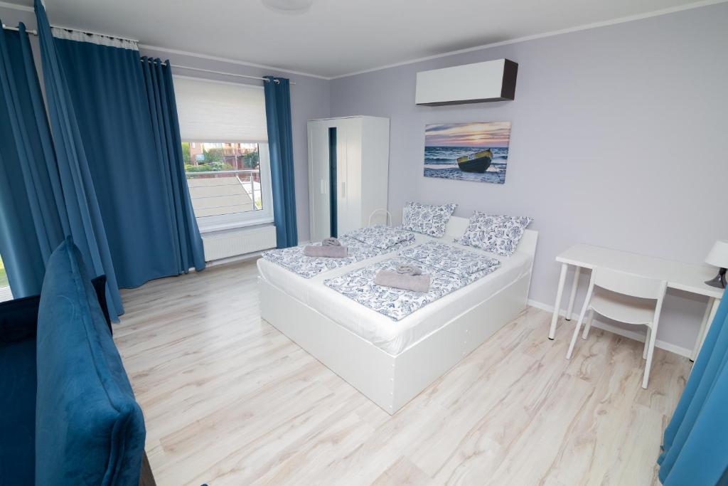 Posteľ alebo postele v izbe v ubytovaní Apartamenty 4YOU Hel