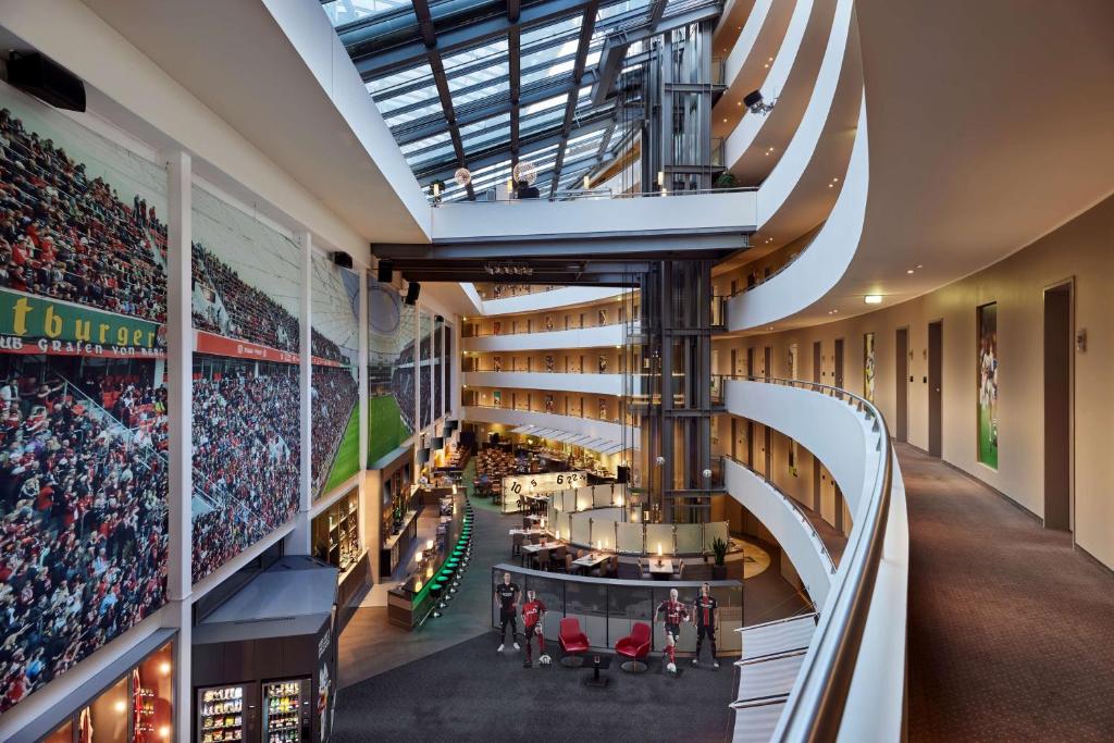 an interior view of a baseball stadium with a crowd at Lindner Hotel Leverkusen BayArena, part of JdV by Hyatt in Leverkusen