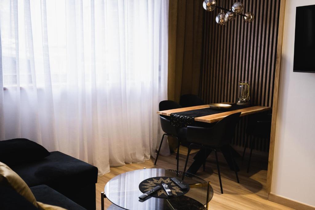 Televízia a/alebo spoločenská miestnosť v ubytovaní Apartament 88
