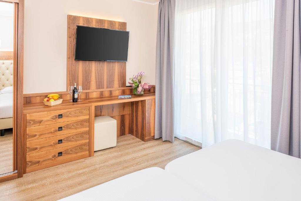 TV a/nebo společenská místnost v ubytování Hotel Centrale