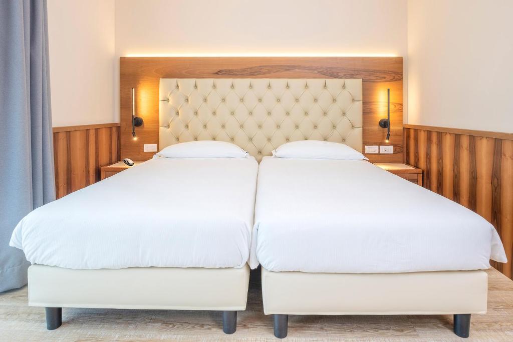 Postel nebo postele na pokoji v ubytování Hotel Centrale