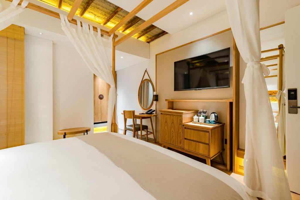 Postel nebo postele na pokoji v ubytování Yoba Boutique Hotel