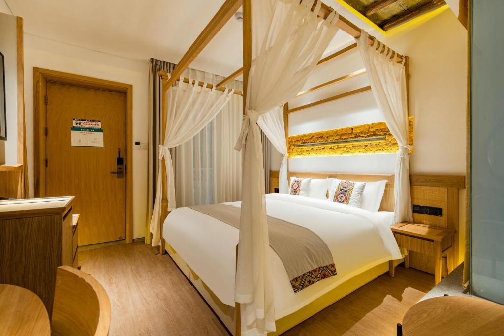 Postel nebo postele na pokoji v ubytování Yoba Boutique Hotel