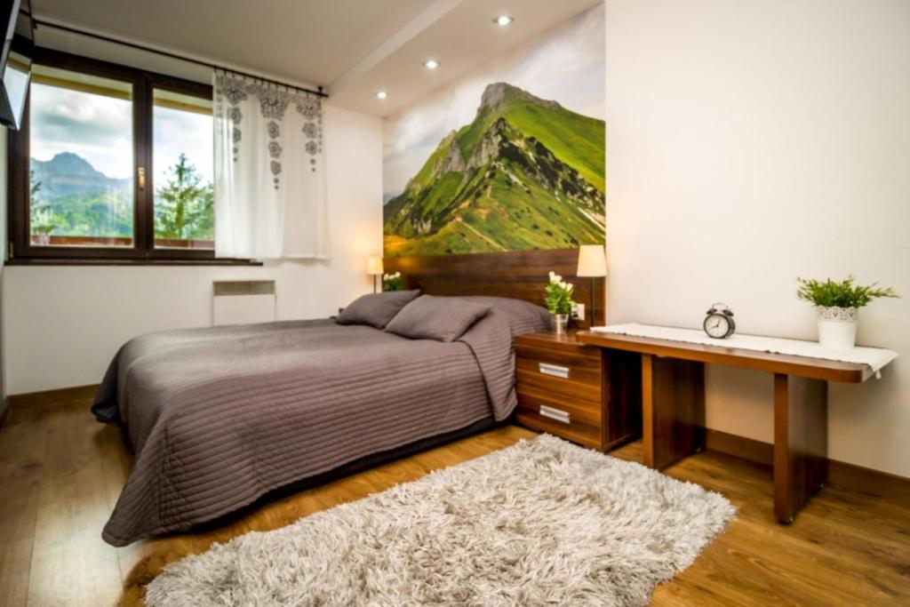 Posteľ alebo postele v izbe v ubytovaní Mountain Apartments Butorowy Sauna Residence