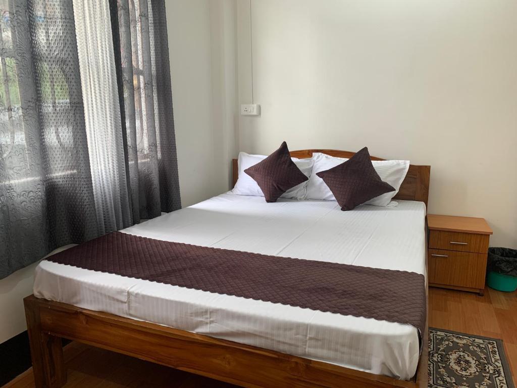 Postel nebo postele na pokoji v ubytování Aama Home Stay
