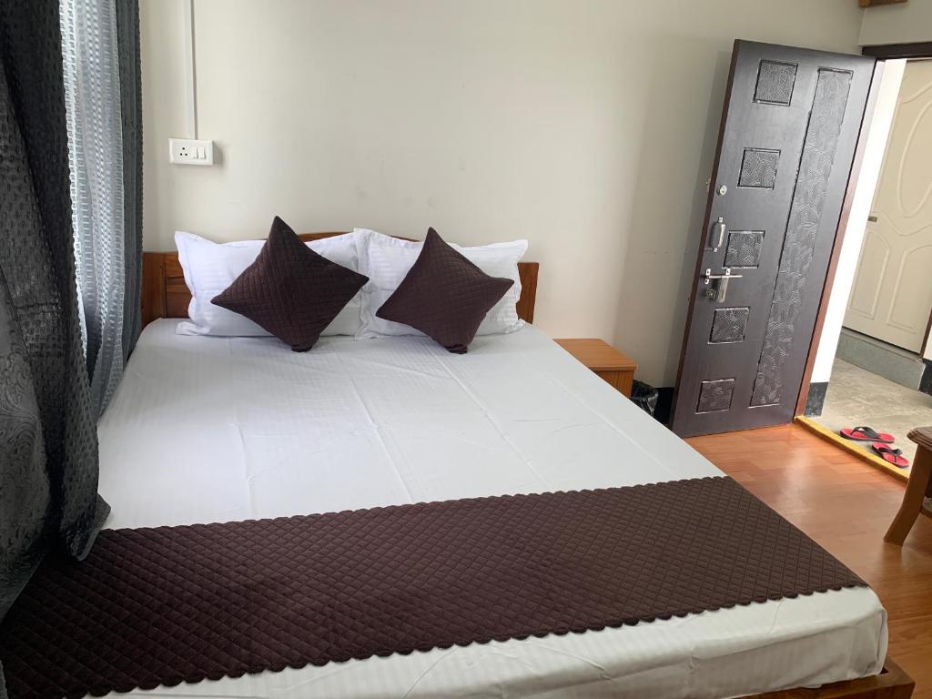 Postel nebo postele na pokoji v ubytování Aama Home Stay