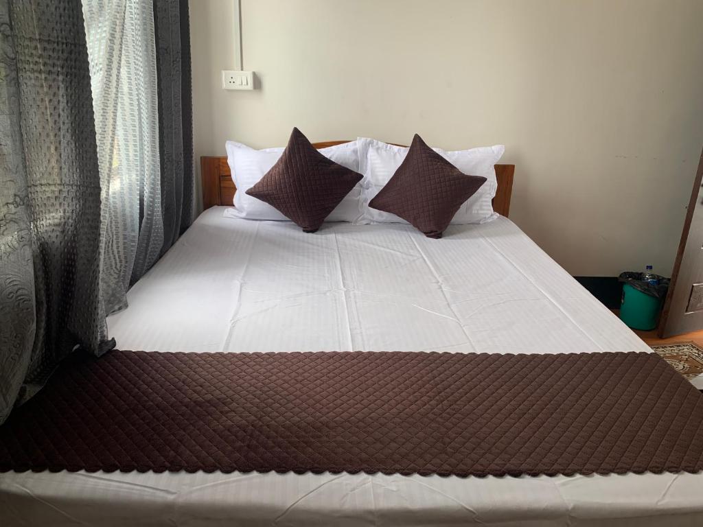 Postel nebo postele na pokoji v ubytování Aama Home Stay
