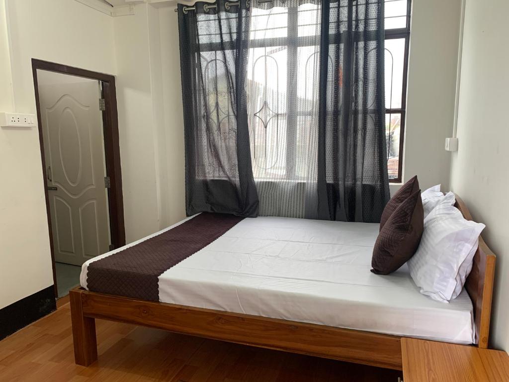 Postel nebo postele na pokoji v ubytování Aama Home Stay