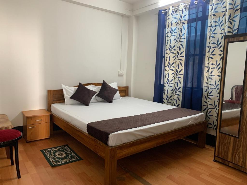 Postel nebo postele na pokoji v ubytování Aama Home Stay
