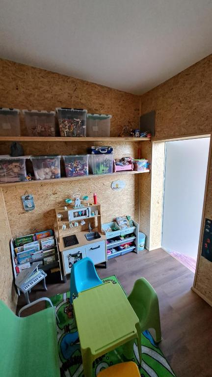 a classroom with a table and chairs in a room at Apartment Schloffer in Weiz