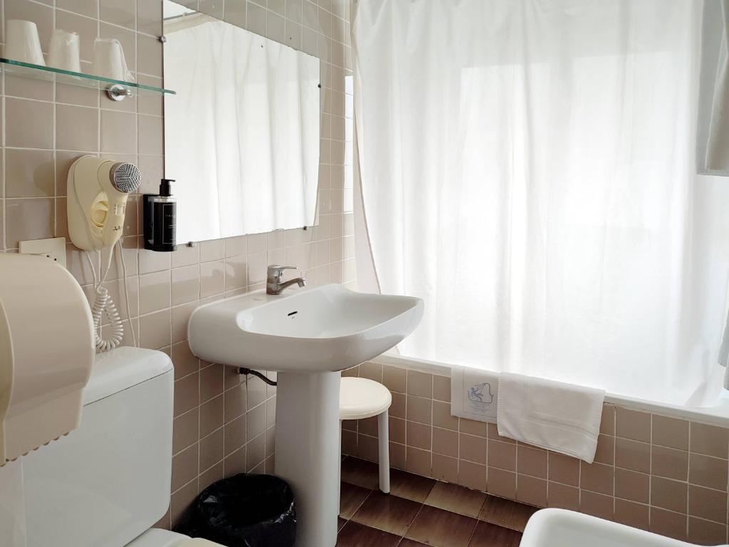 Koupelna v ubytování Hotel Porto