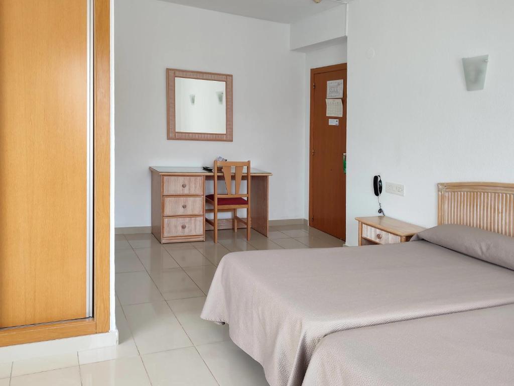 Postel nebo postele na pokoji v ubytování Hotel Porto