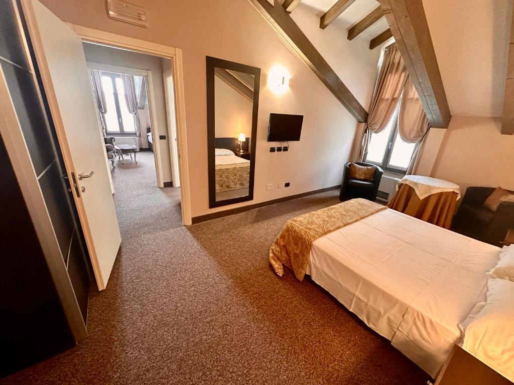 Postel nebo postele na pokoji v ubytování Hotel Malpensa INN Aereoporto