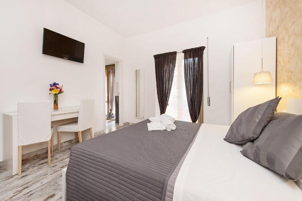 A bed or beds in a room at De Guestibus