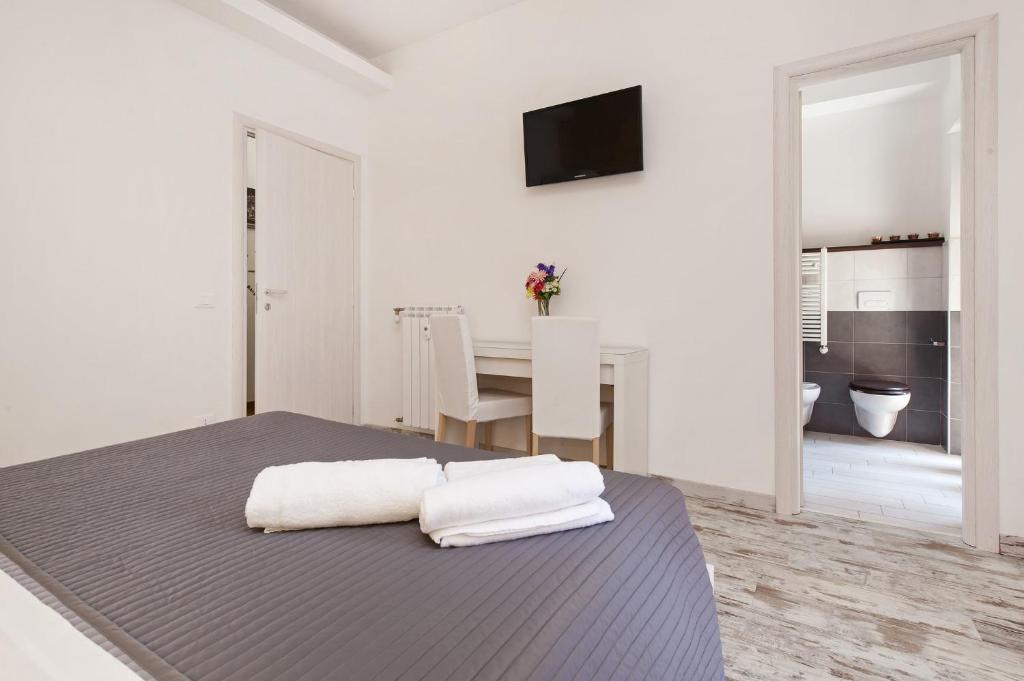 A bed or beds in a room at De Guestibus