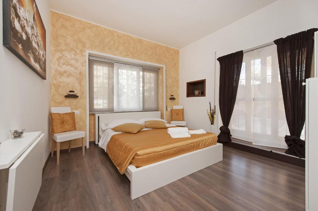 A bed or beds in a room at De Guestibus