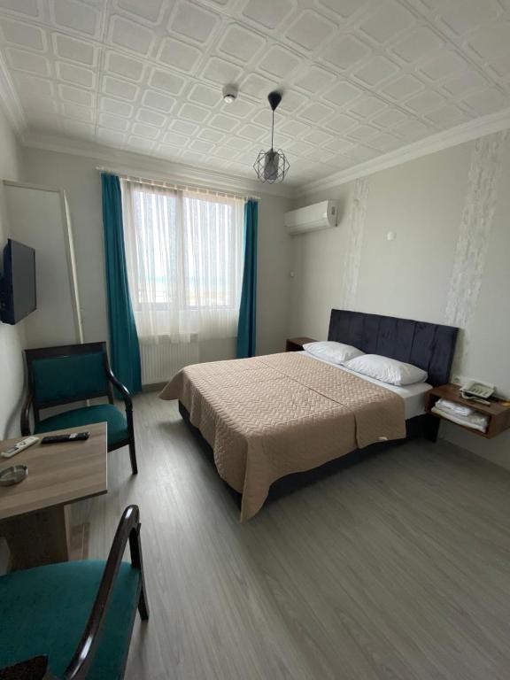 Postel nebo postele na pokoji v ubytování Elite Holiday Hotel
