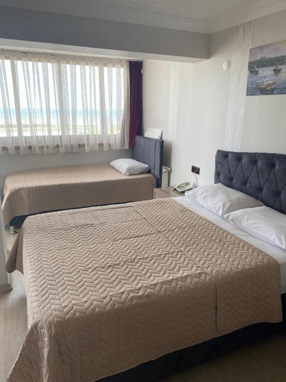 Postel nebo postele na pokoji v ubytování Elite Holiday Hotel