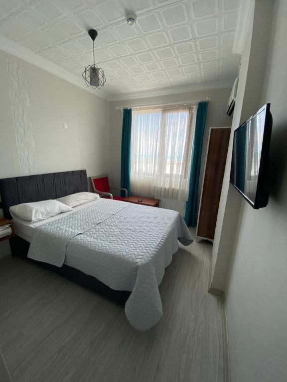 Postel nebo postele na pokoji v ubytování Elite Holiday Hotel