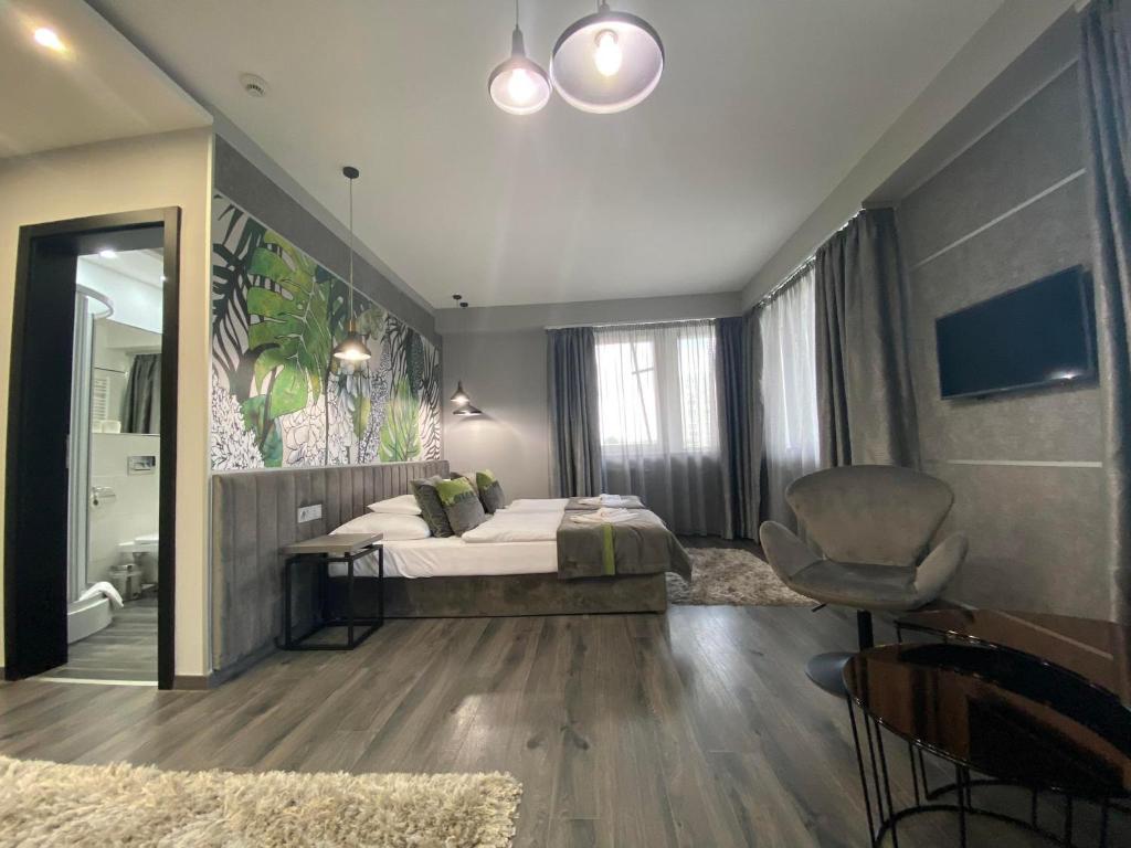 Posteľ alebo postele v izbe v ubytovaní Hotel Central