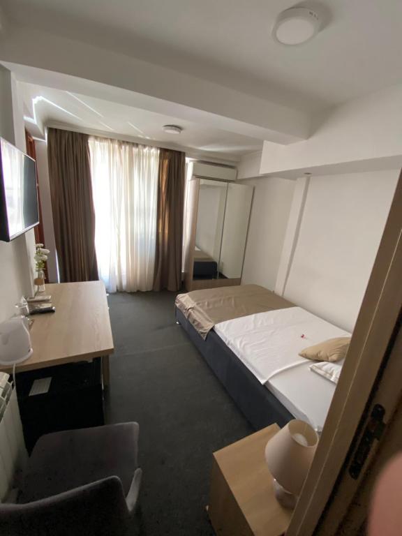 Postel nebo postele na pokoji v ubytování Hotel Skala