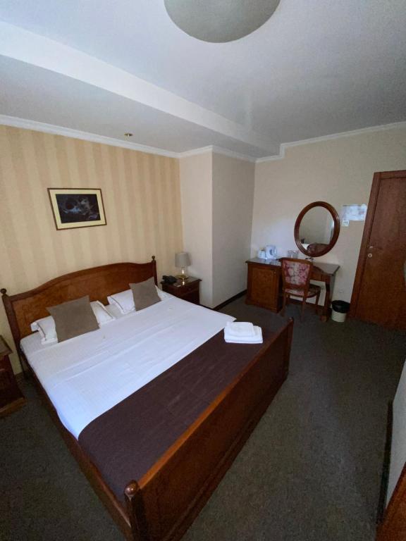 Postel nebo postele na pokoji v ubytování Hotel Skala
