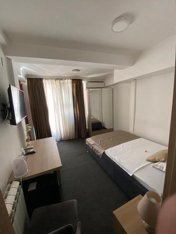 Postel nebo postele na pokoji v ubytování Hotel Skala