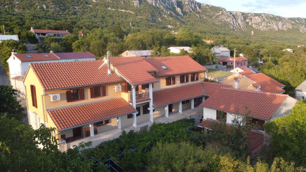 a group of houses with red roofs on a mountain at Summer Residence Illyria in Bribir