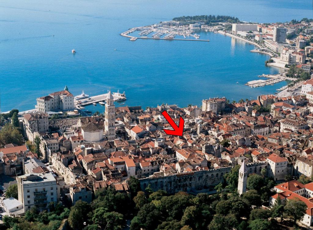 a view of a city with a red arrow at Opium Old City Apartment in Split