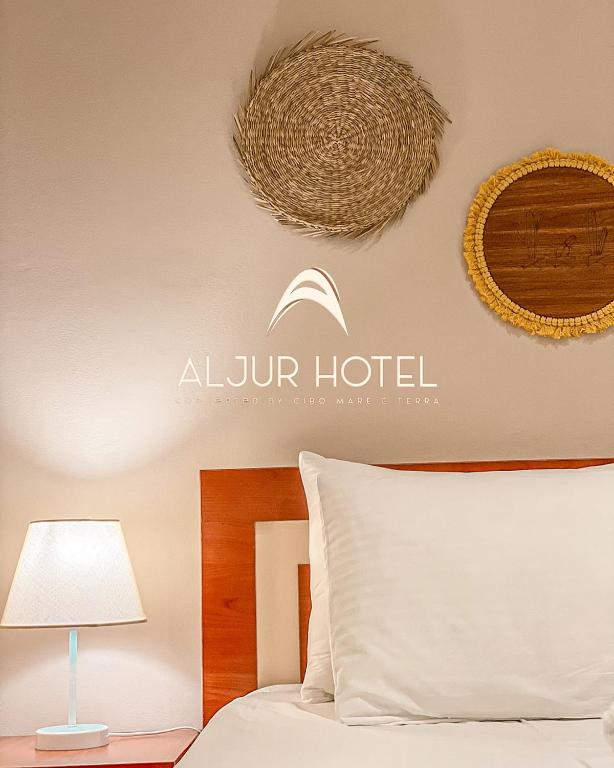 Postel nebo postele na pokoji v ubytování Aljur Hotel