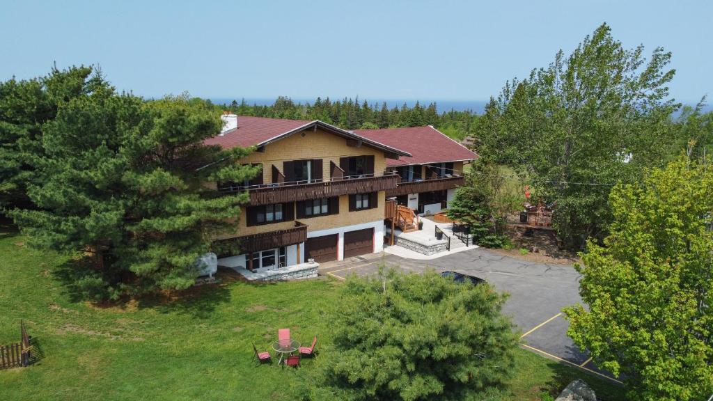 an aerial view of a large house with a yard at Edelweiss Inn Nova Scotia in Middleton