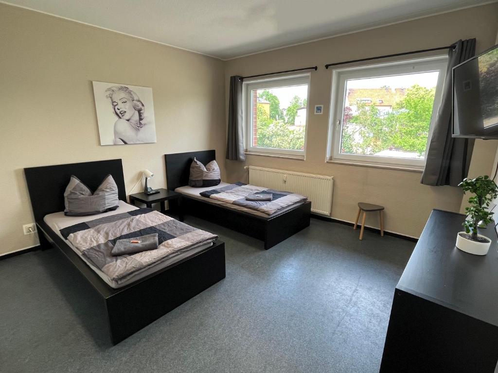 Ένα ή περισσότερα κρεβάτια σε δωμάτιο στο Zimmervermietung Allstedt