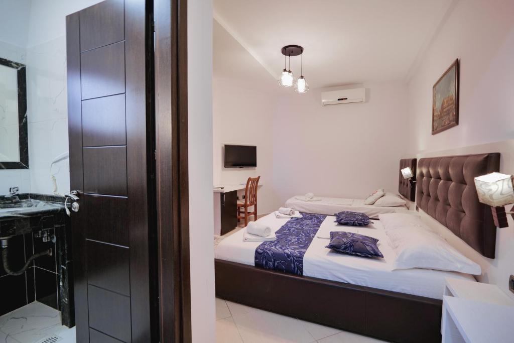 Postel nebo postele na pokoji v ubytování Grand Hotel Aita