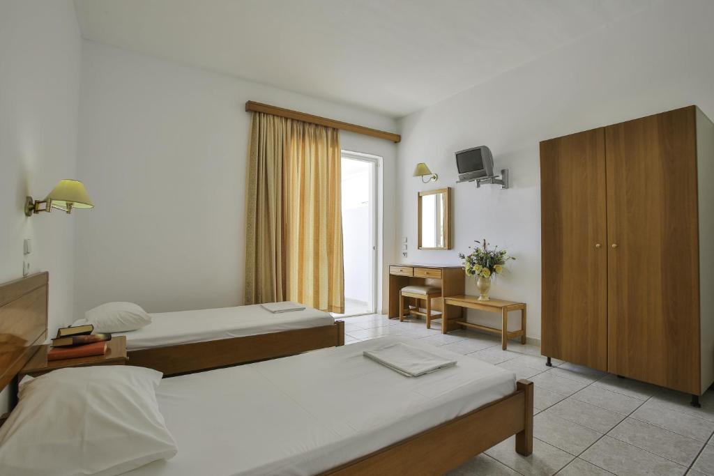 Postel nebo postele na pokoji v ubytování Orion Hotel