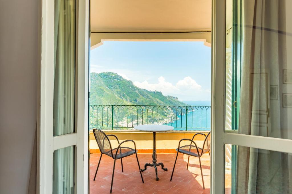 a view of a balcony with a table and chairs at Starhost - Casa del Principe in Ravello