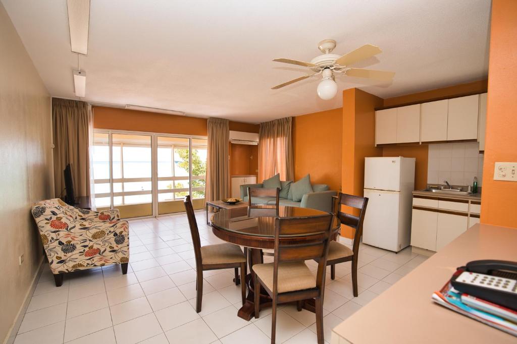 a kitchen and dining room with a table and chairs at Horizon View Beach Hotel in Philipsburg