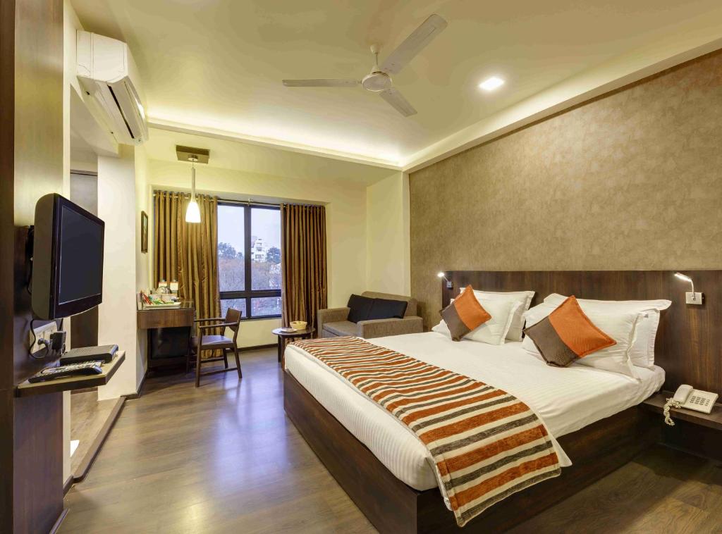 Regenta Place Raysons Kolhapur - デラックスクイーンルーム