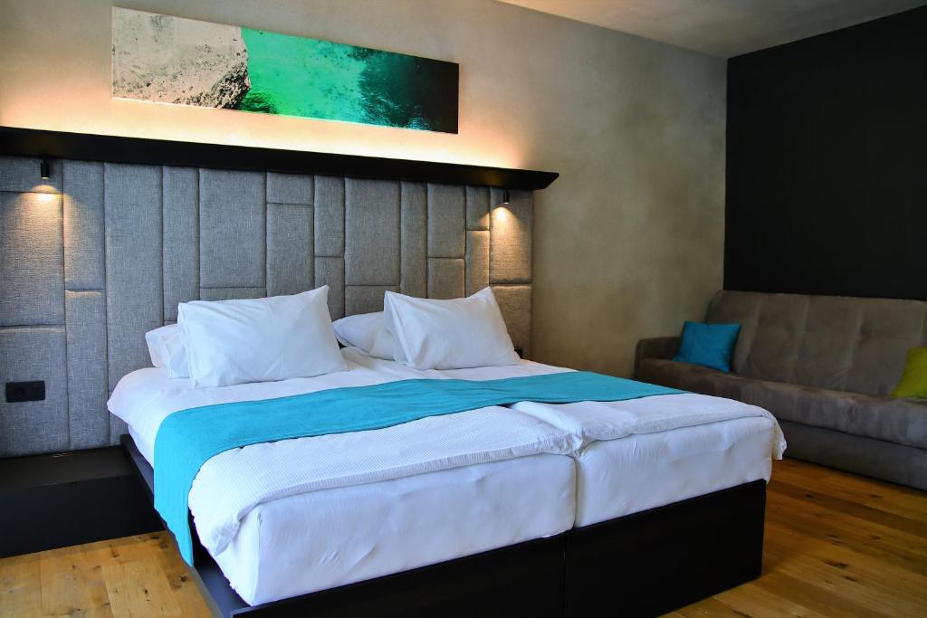 Postel nebo postele na pokoji v ubytování Hotel Soča