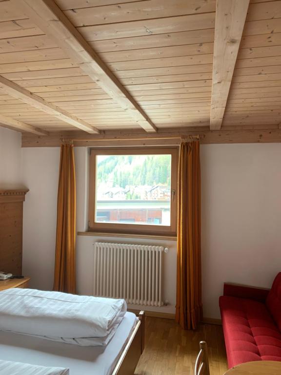 Postel nebo postele na pokoji v ubytování Hotel Alpenhof