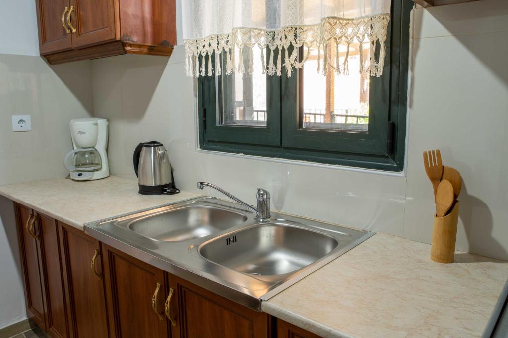 Kuchyň nebo kuchyňský kout v ubytování House Rachati