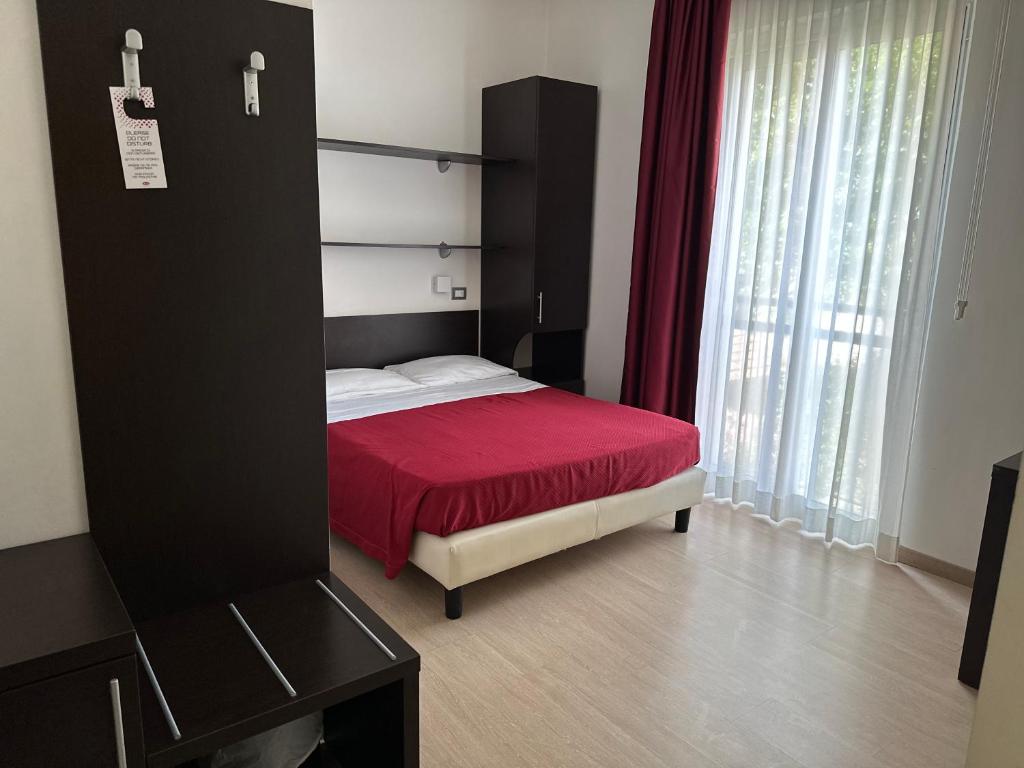 Postel nebo postele na pokoji v ubytování Hotel Morolli