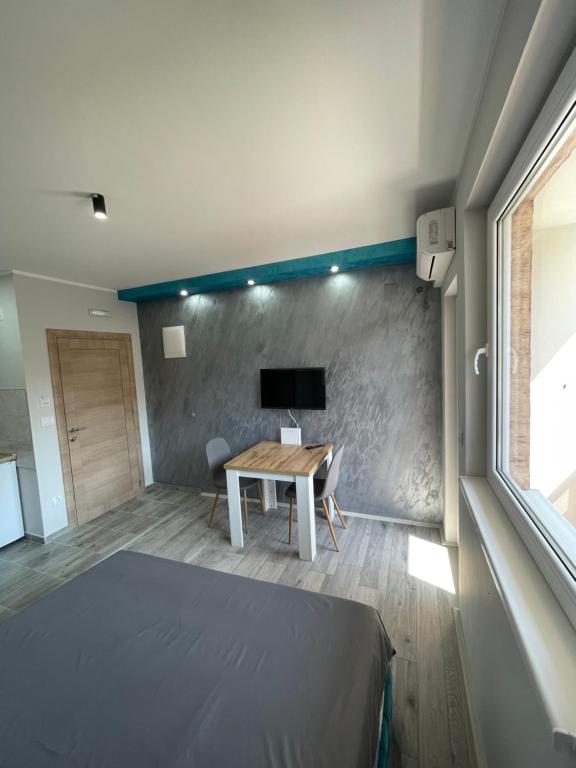 TV a/nebo společenská místnost v ubytování Apartmani borova 2