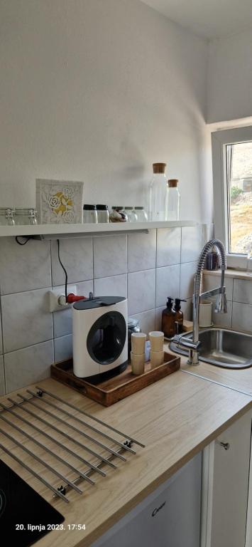 Kuchyň nebo kuchyňský kout v ubytování L'infini Sea View apartments Zubovići
