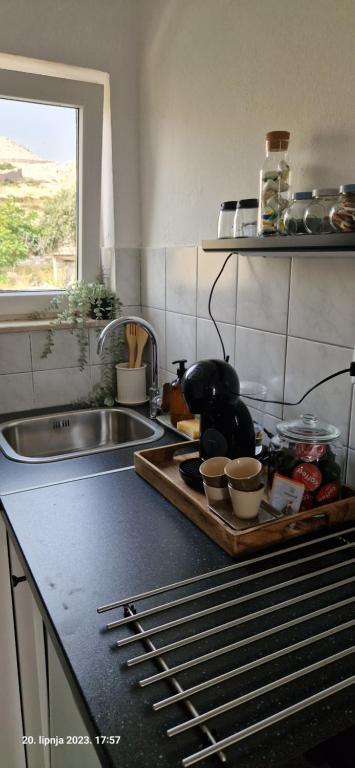 Kuchyň nebo kuchyňský kout v ubytování L'infini Sea View apartments Zubovići