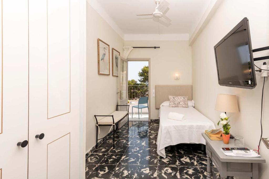 Cama ou camas em um quarto em Boutique Hotel Oriola