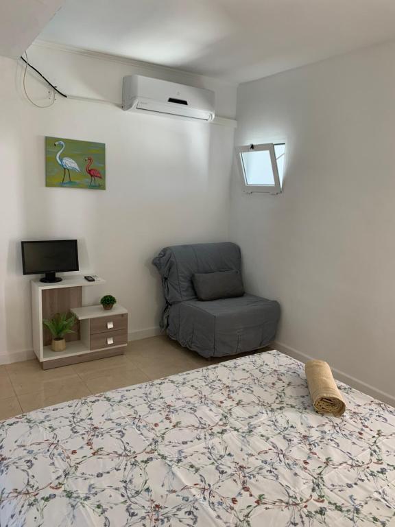 Postel nebo postele na pokoji v ubytování Casa los Pinos Calpe Playa