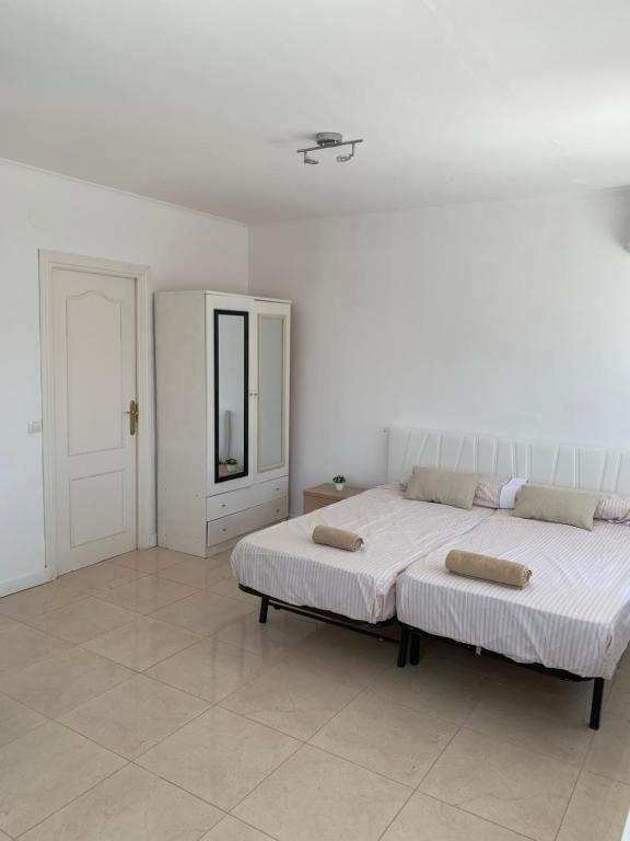 Postel nebo postele na pokoji v ubytování Casa los Pinos Calpe Playa