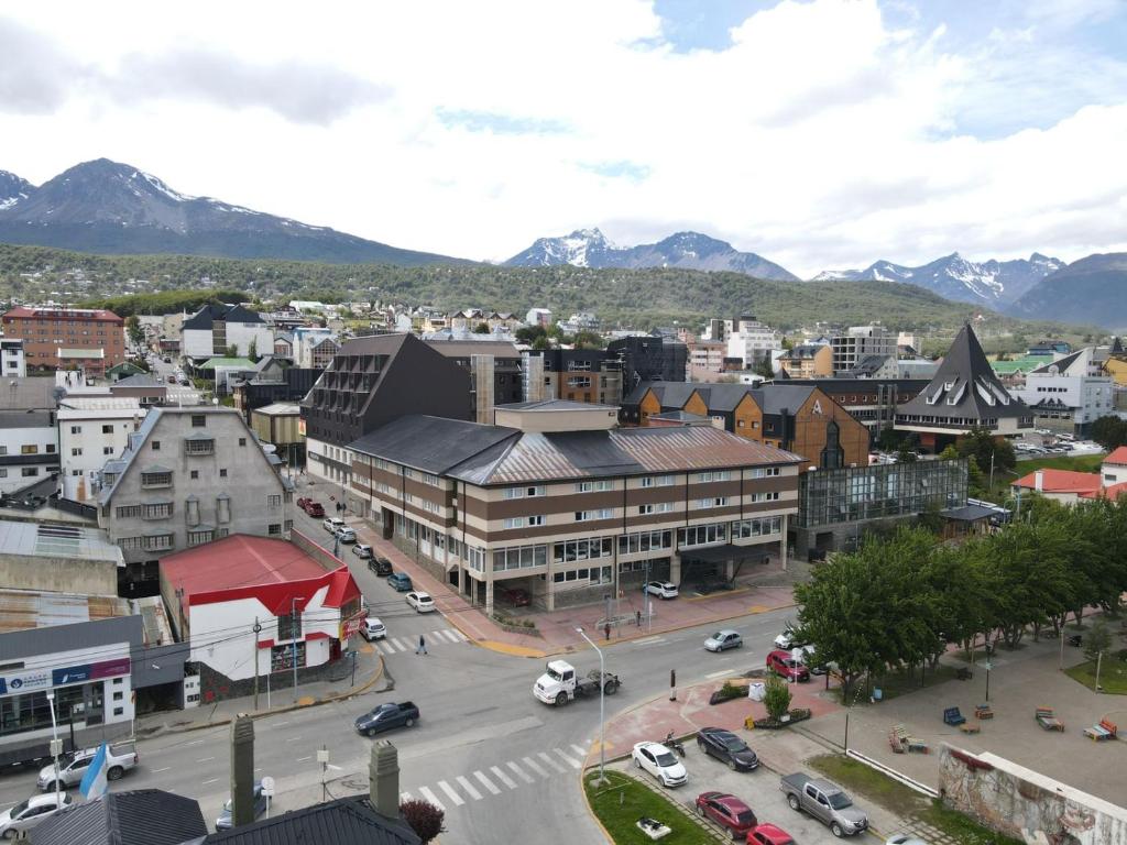 an aerial view of a city with mountains in the background at Hotel Canal Beagle in Ushuaia