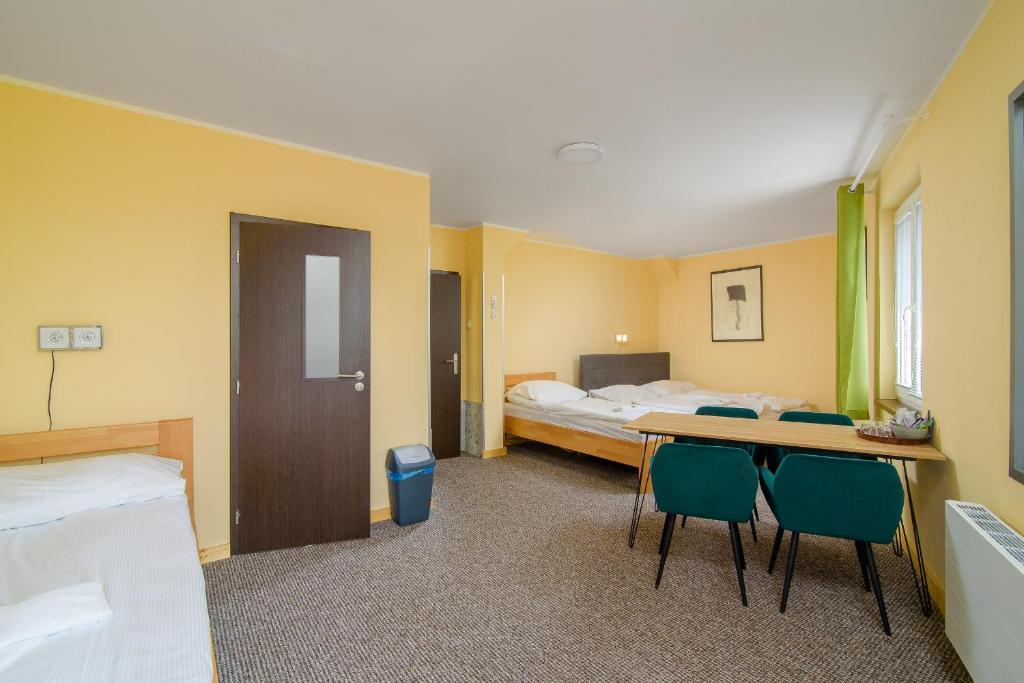 Postel nebo postele na pokoji v ubytování Hotel Max